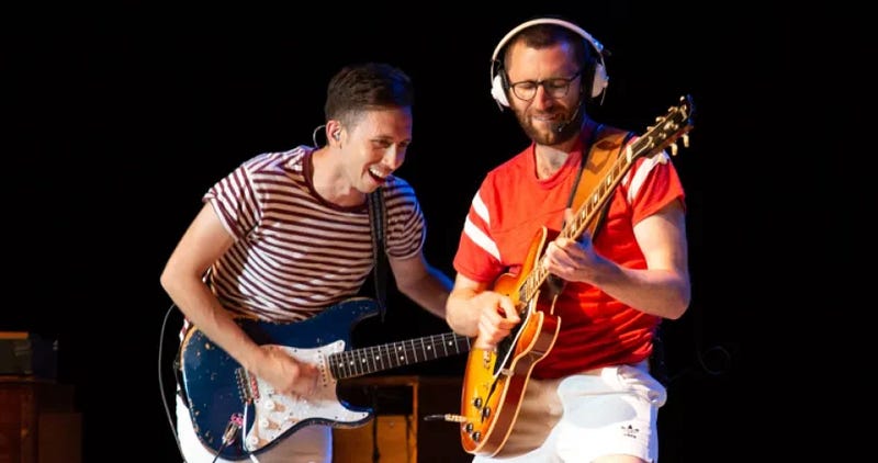 Jack Stratton and Cory Wong performing on guitar